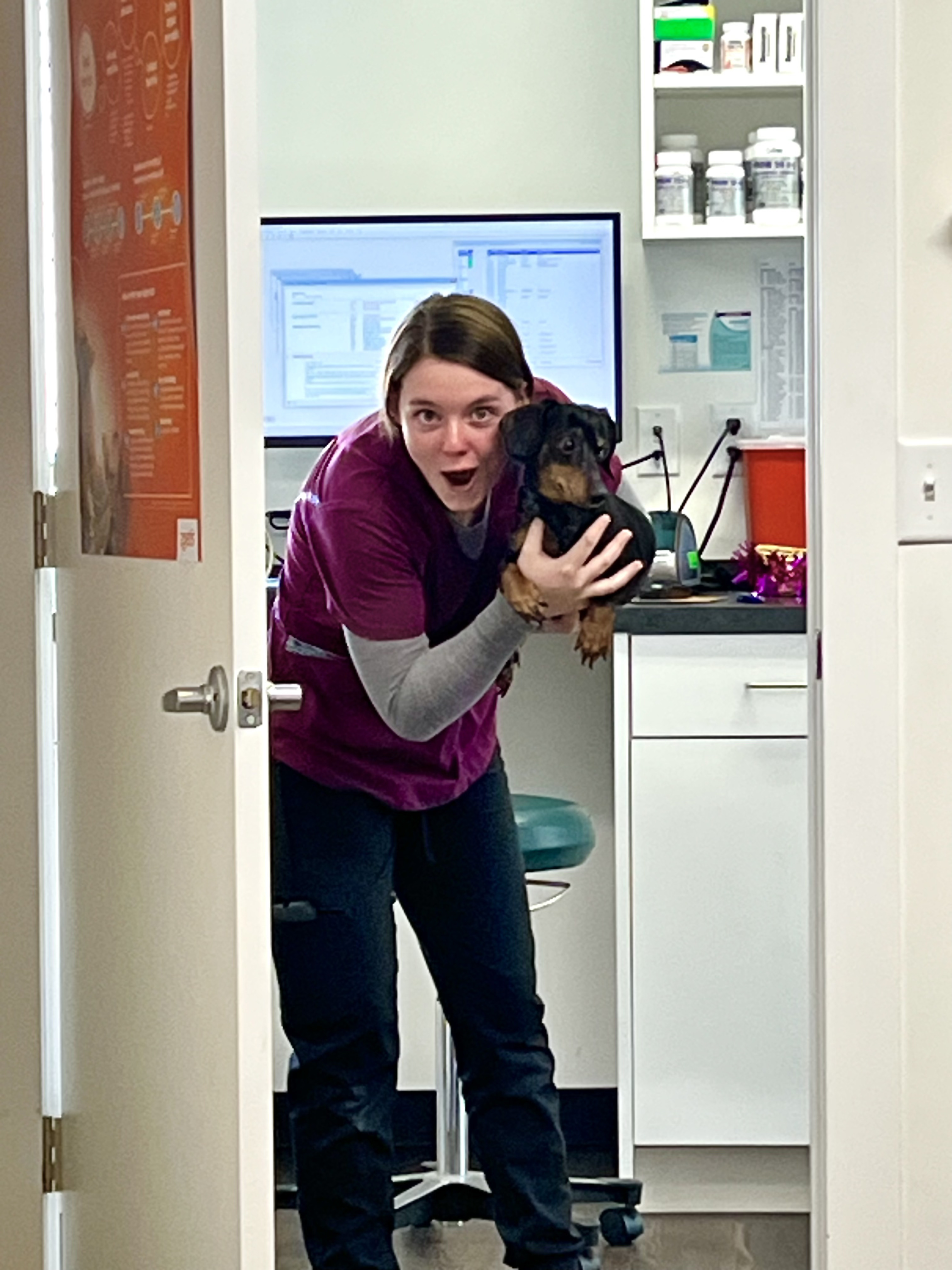 Emma with dog in exam room